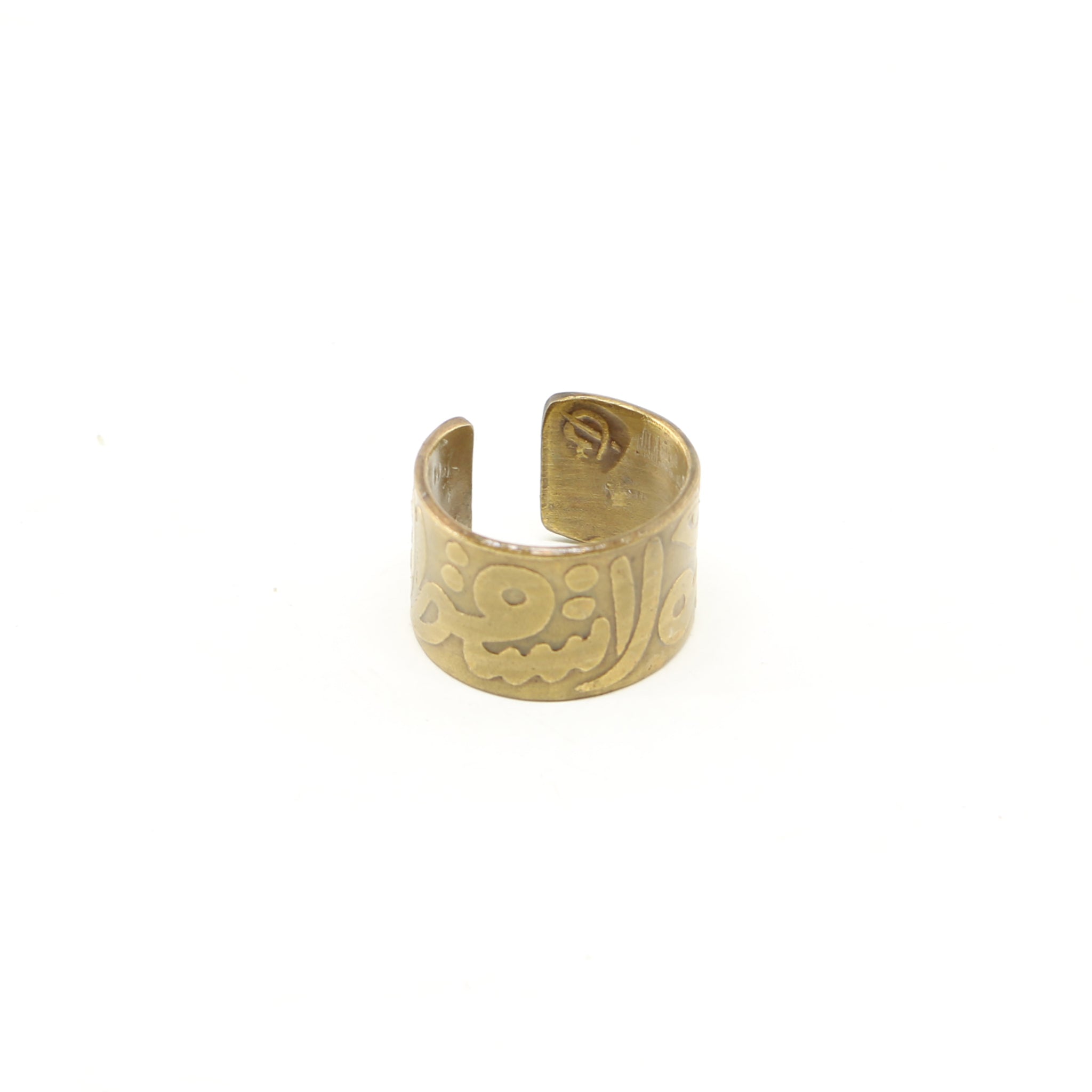 Handmade Gold brass ring featuring ornate Arabic calligraphy of the words "Love Never Fails".
