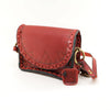 Handmade purse made of 100% genuine leather with adjustable straps, embossed with triangular patterns. 