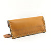 Handmade pouch made of 100% genuine leather embossed with spiral patterns.