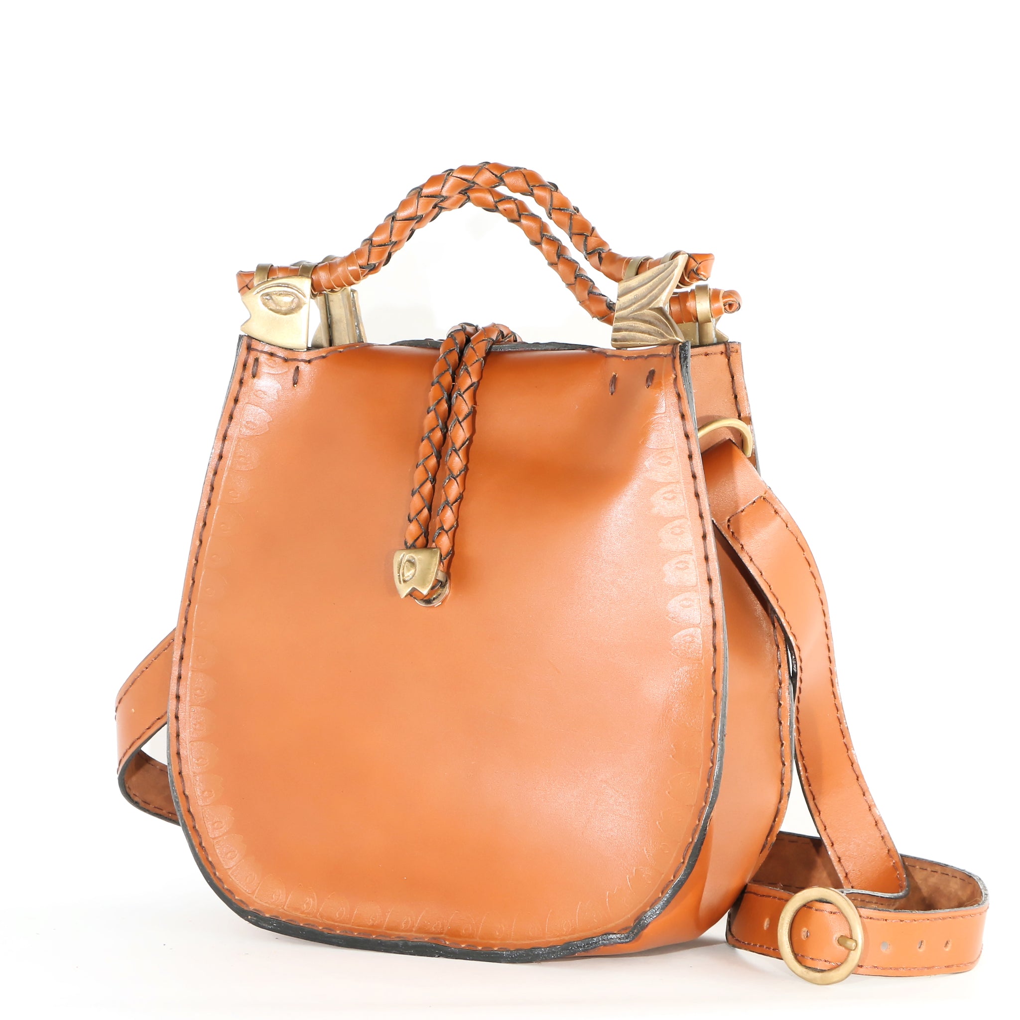 Handmade handbag made of 100% genuine leather with an adjustable shoulder strap. The bag features a braided leather handle decorated with a gold brass fish head and tail. The bag uses a braided leather strap decorated with a magnetic silver brass fish head for closure.