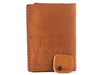 Handmade passport wallet made of 100% genuine leather embossed with a leaves pattern.
