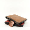 Handmade passport wallet made of 100% genuine leather embossed with a triangular pattern.